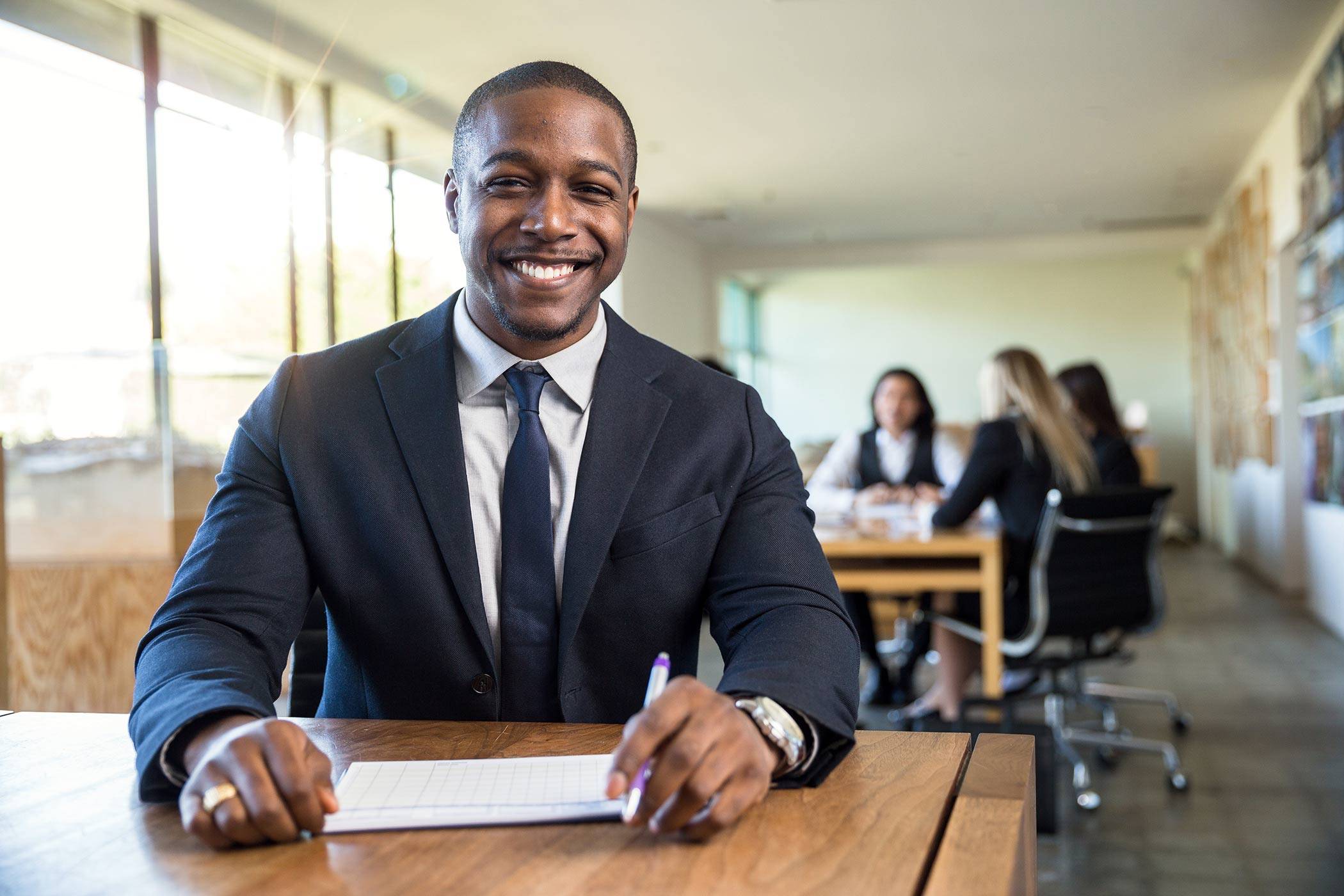 Portrait of african american male staff employee at business finance office charming smile