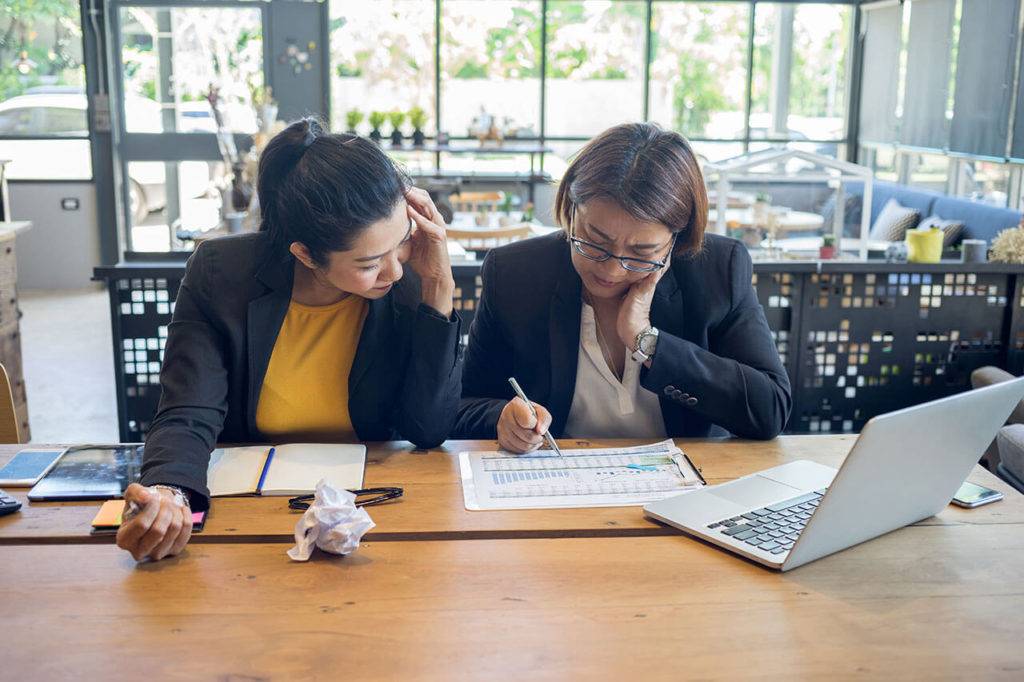Pair of women working together on work project